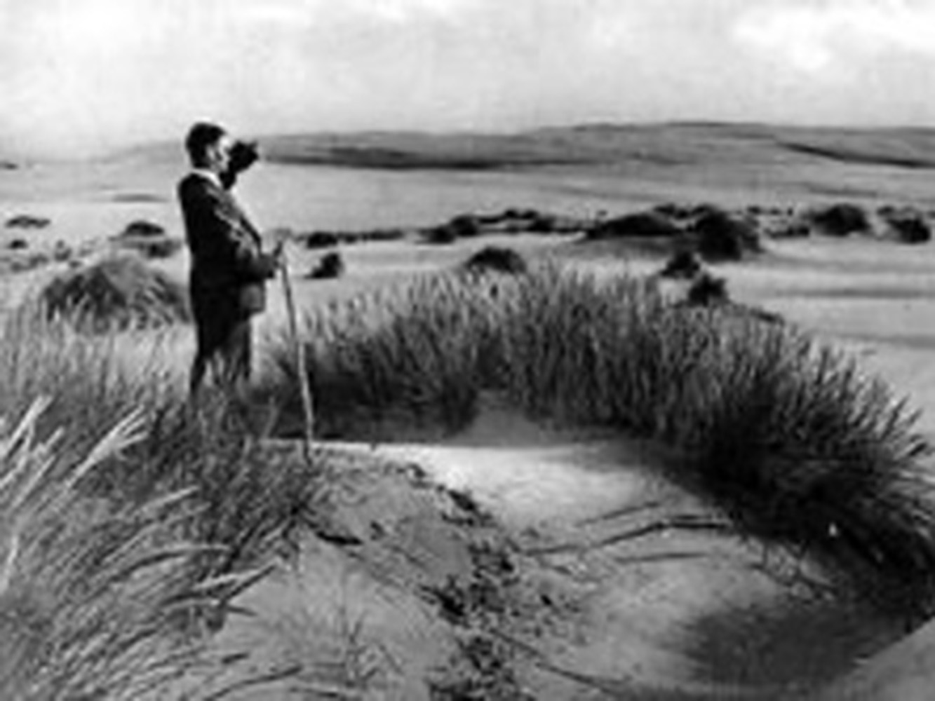 Culbin, black and white image of man on beach