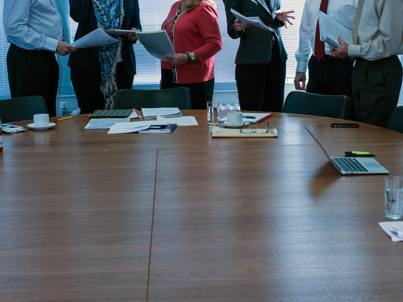 anonymous people around a meeting table