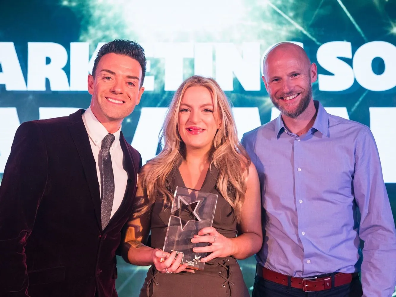 Image shows Communication Design student, Bronny Farqhuar from Gray's, and Des Clarke and Simon Ferguson (right), Deputy Creative Director at Union Direct.