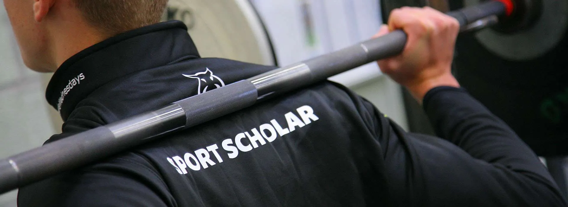RGU SPORT Scholarship student with a weight