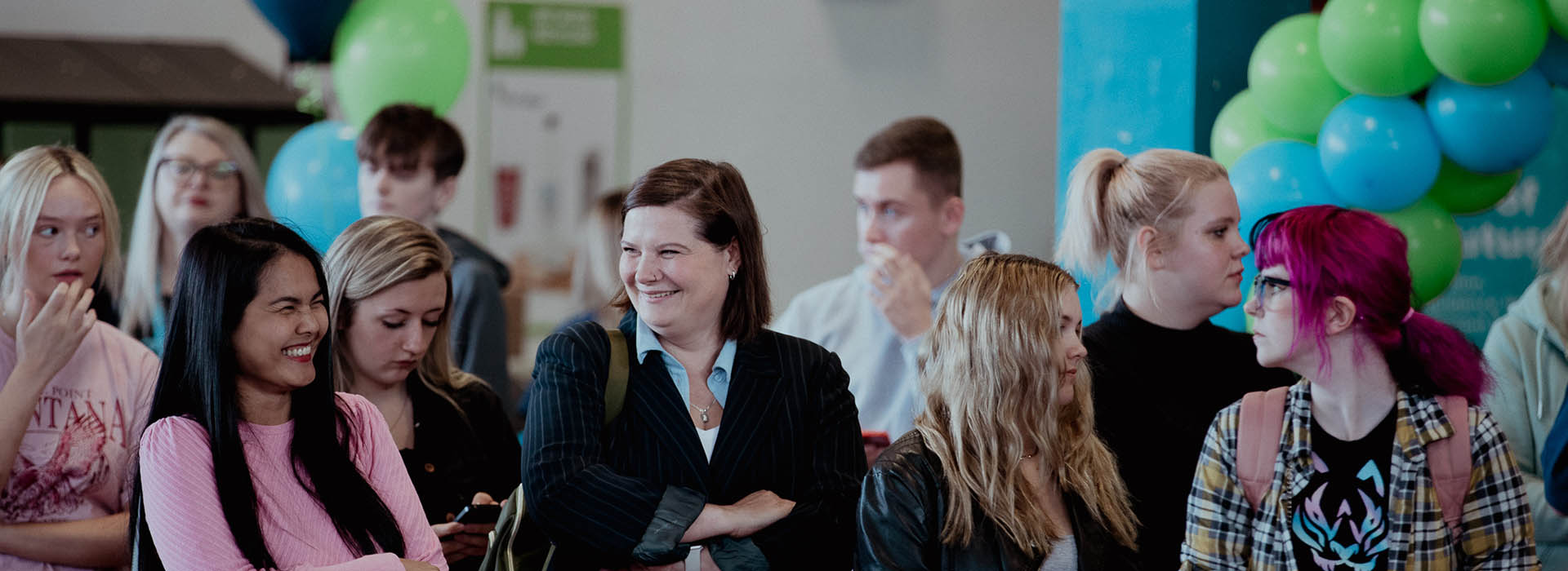 students and staff chatting together