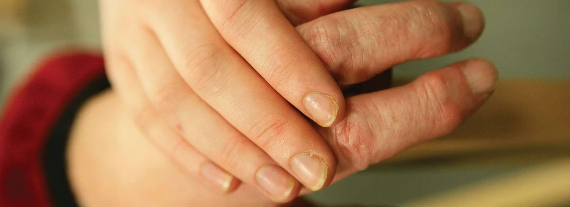 mixed aged people holding hands