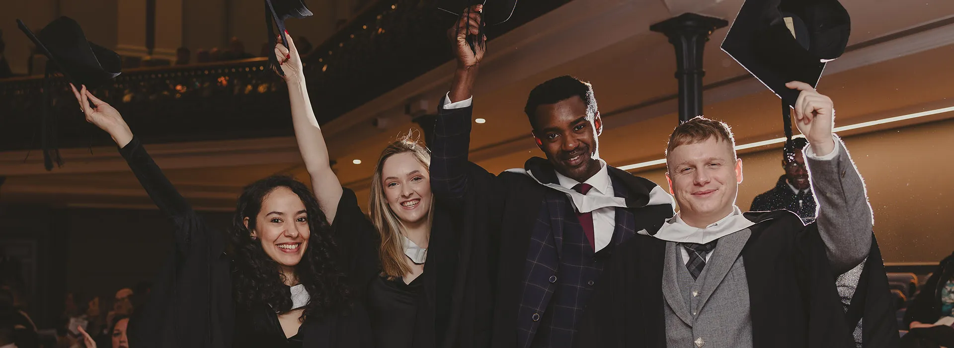 Graduates throwing their hats