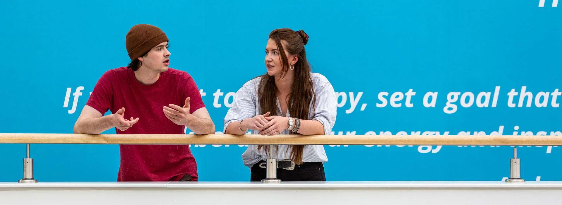 Two students standing ourside the Innovation Centre in Sir Ian Wood Building