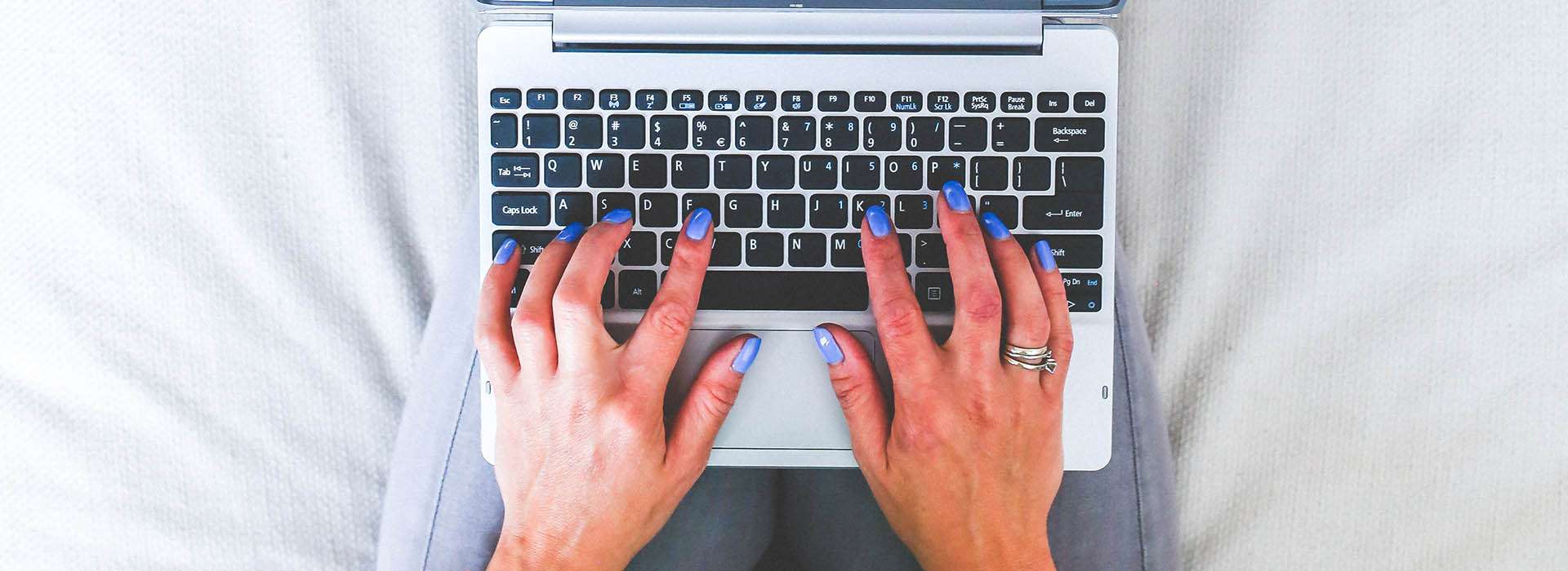 person typing on a laptop