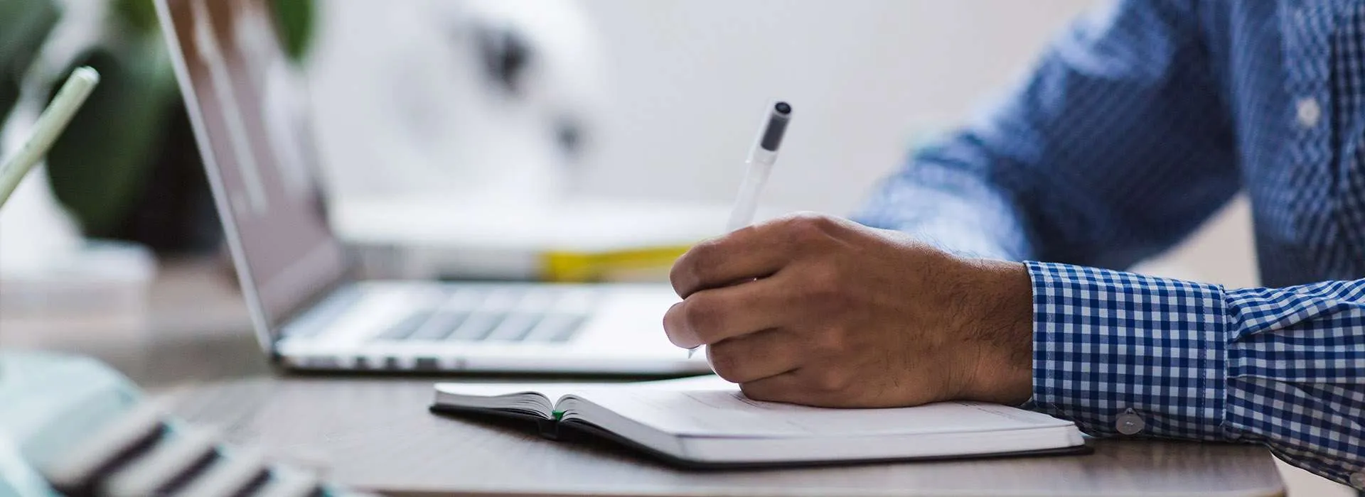 Person writing in a notebook