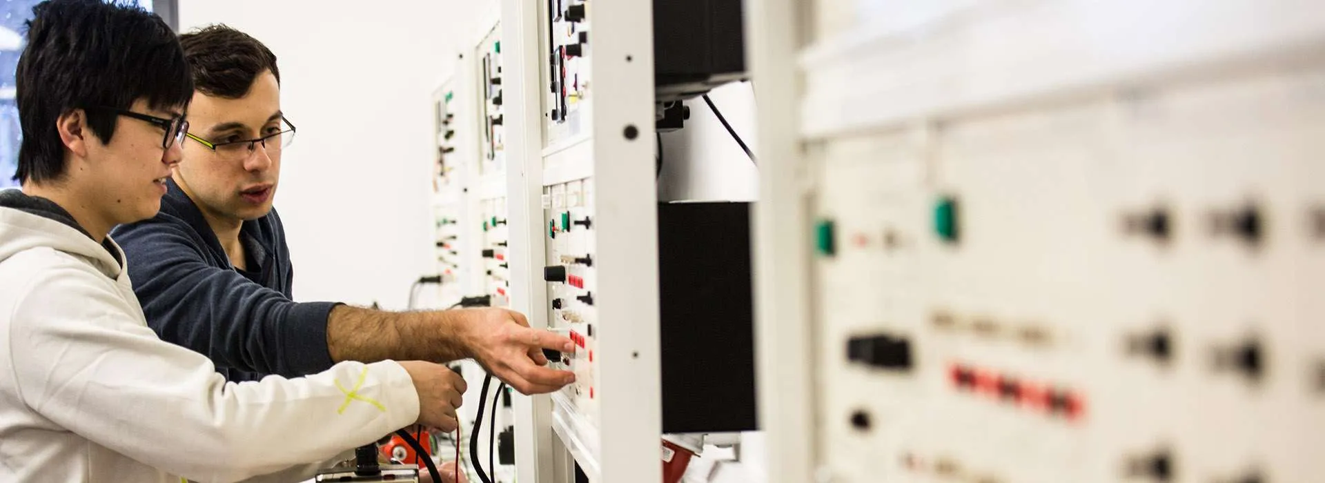 students using an electrical control panel