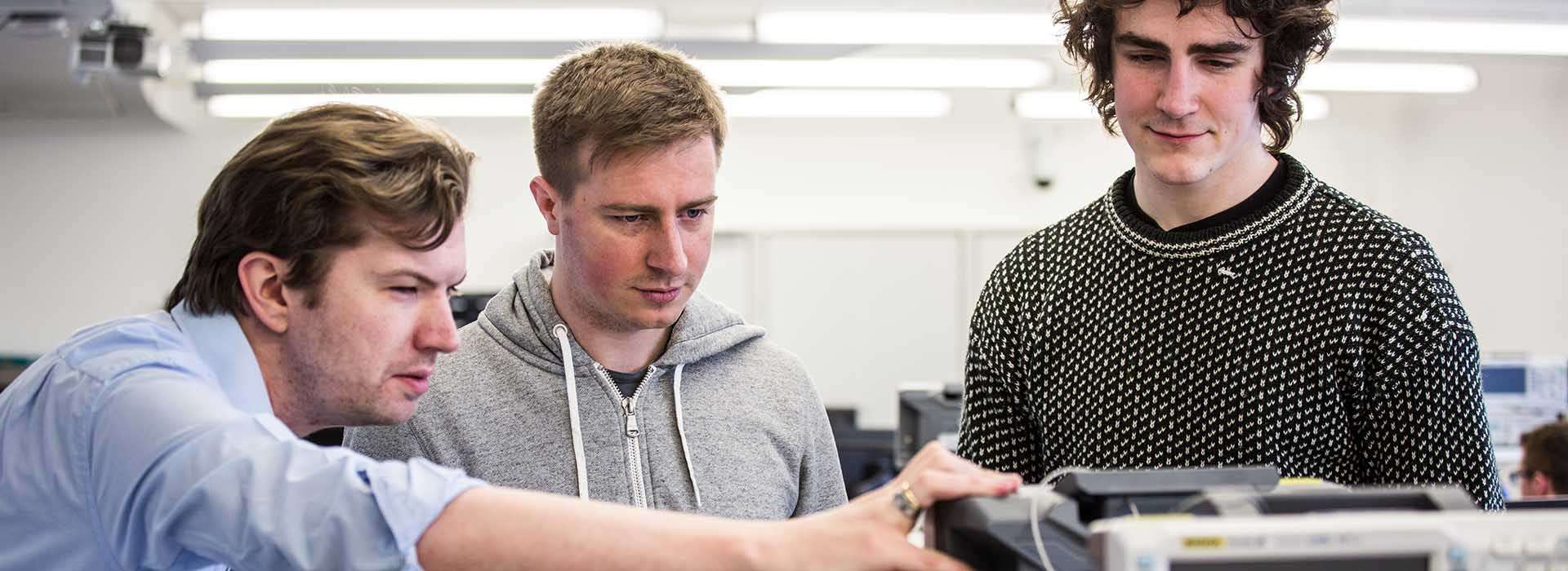 lecturer demonstrating equipment in Electronic Teaching Laboratory