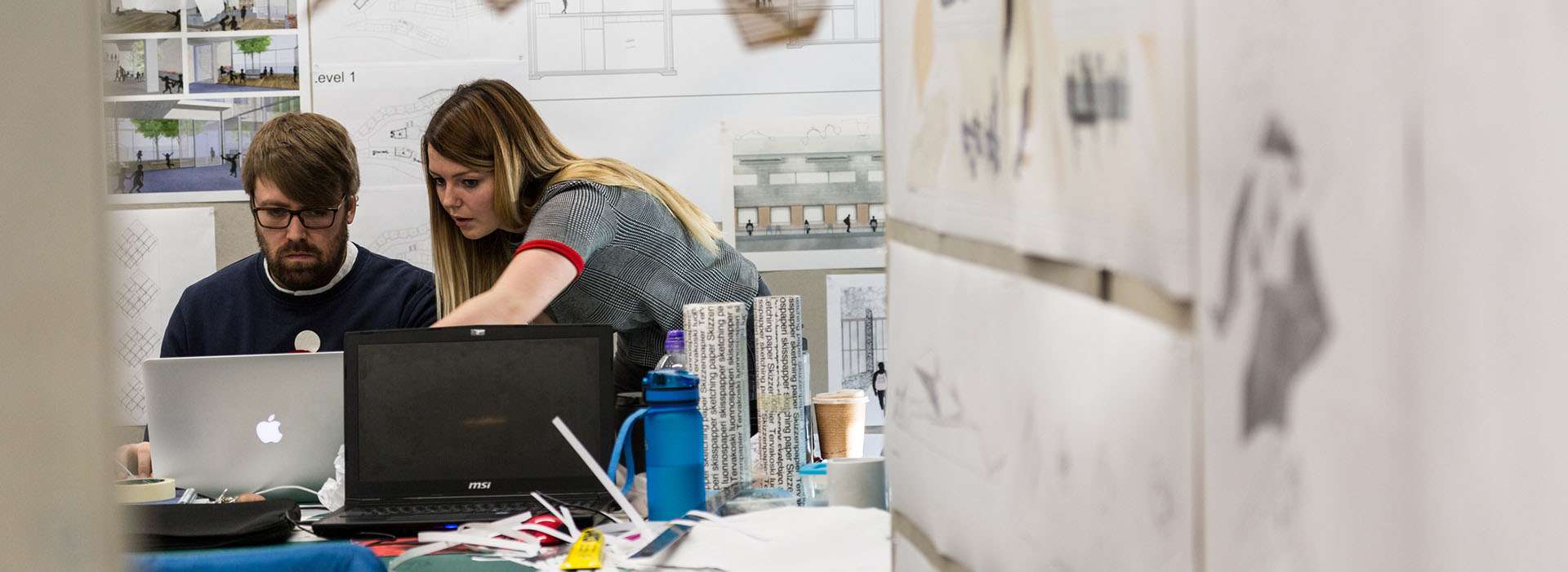 people chatting in architectural workshop