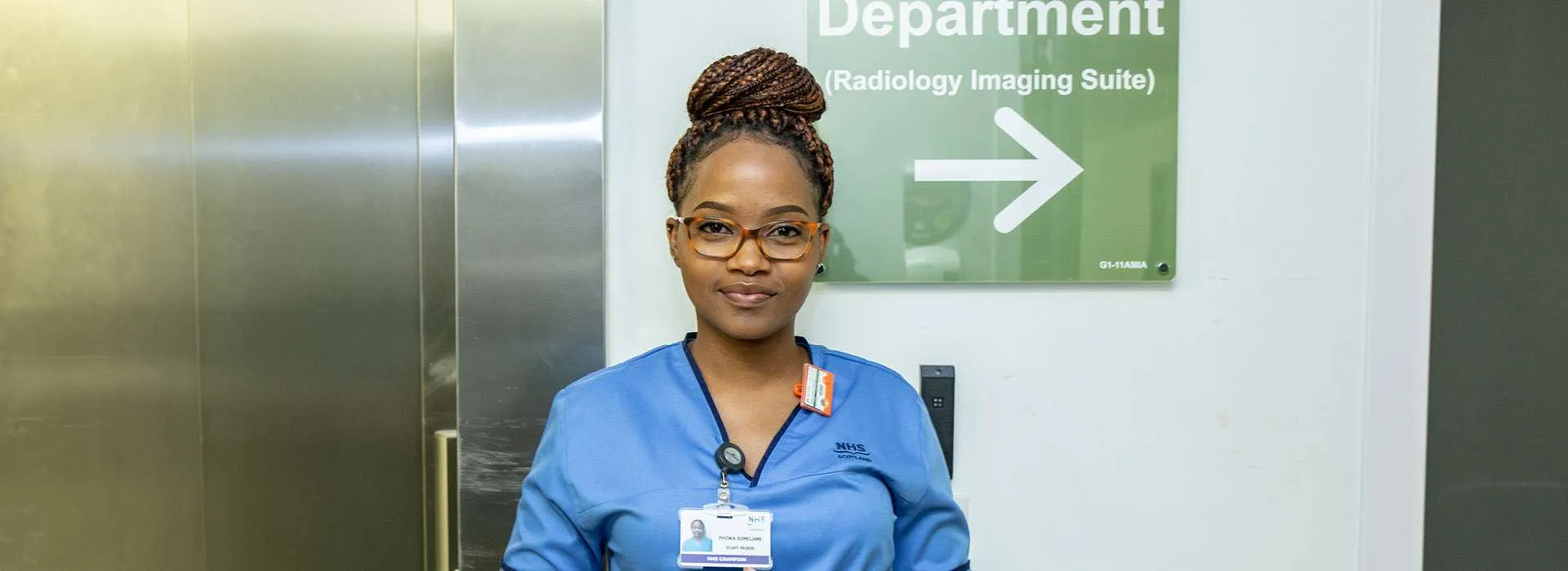 woman in scrubs with stethoscope