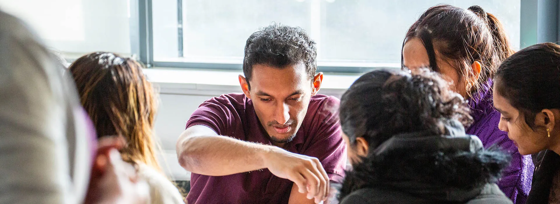 RGU student ambassadors study around a table