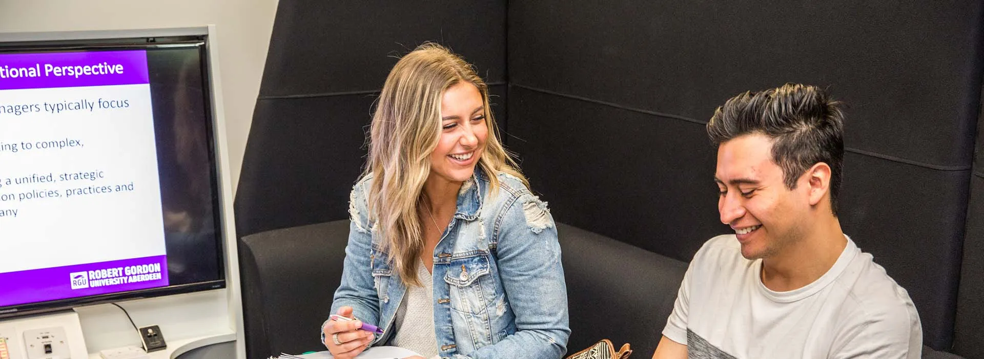 Two students socialising in study area