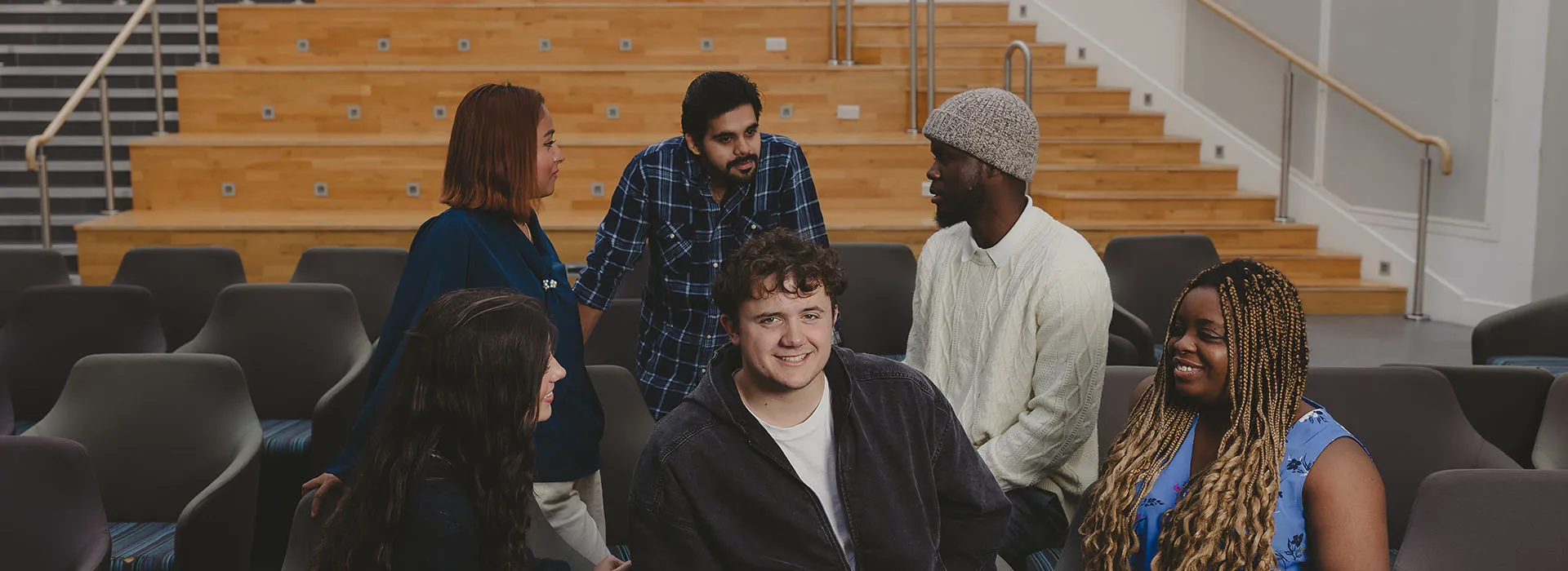 6 students sitting in Sir Ian Wood Building on RGU campus