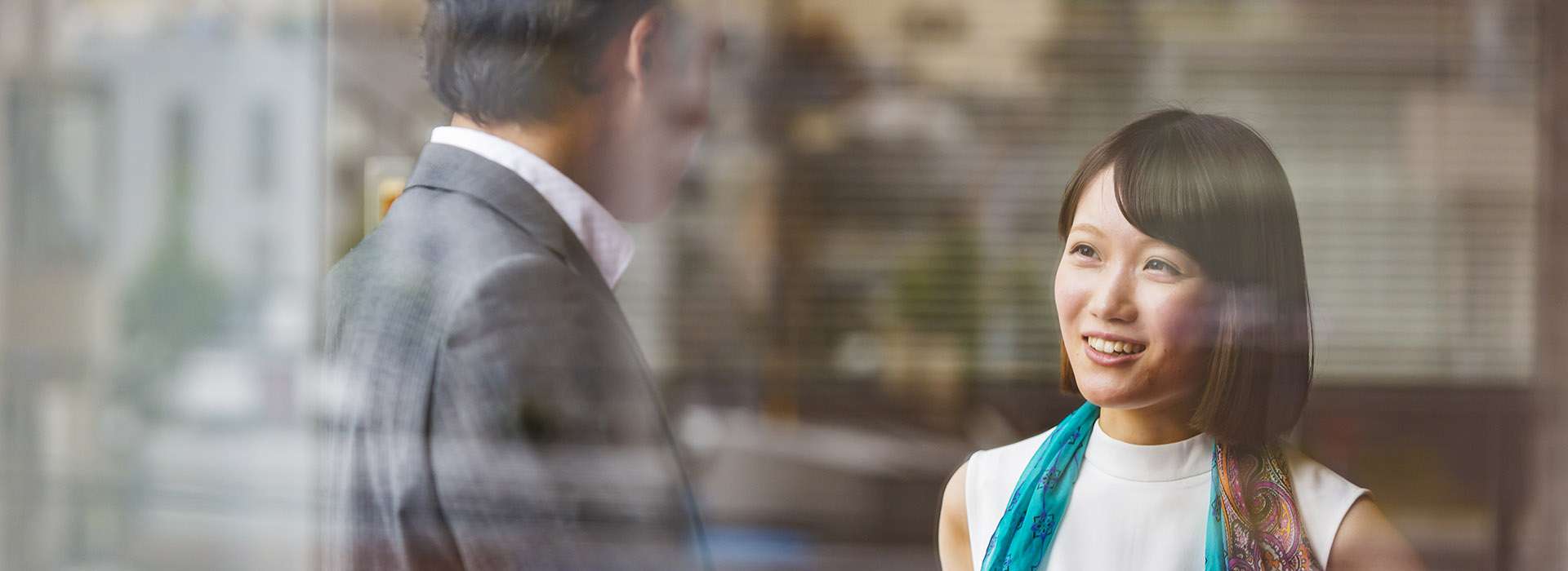 two people in business attire chatting