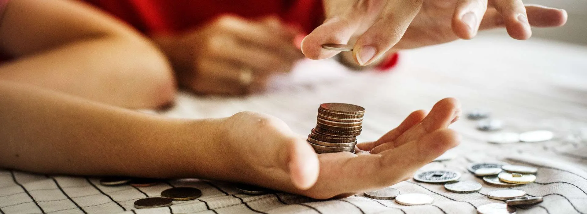 person stacking up coins