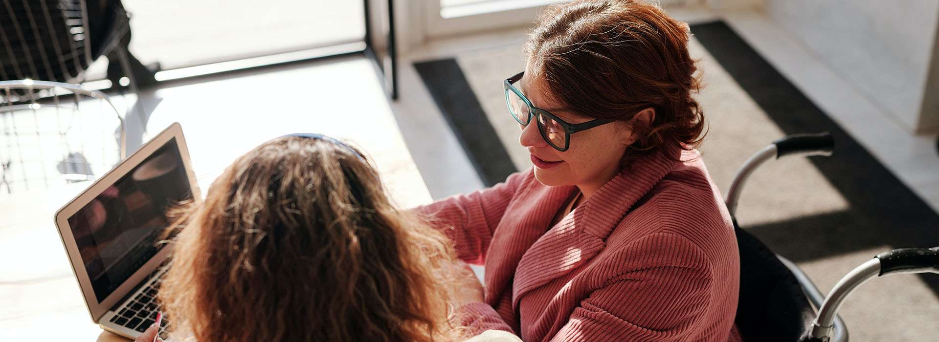 woman in wheelchair in a meeting