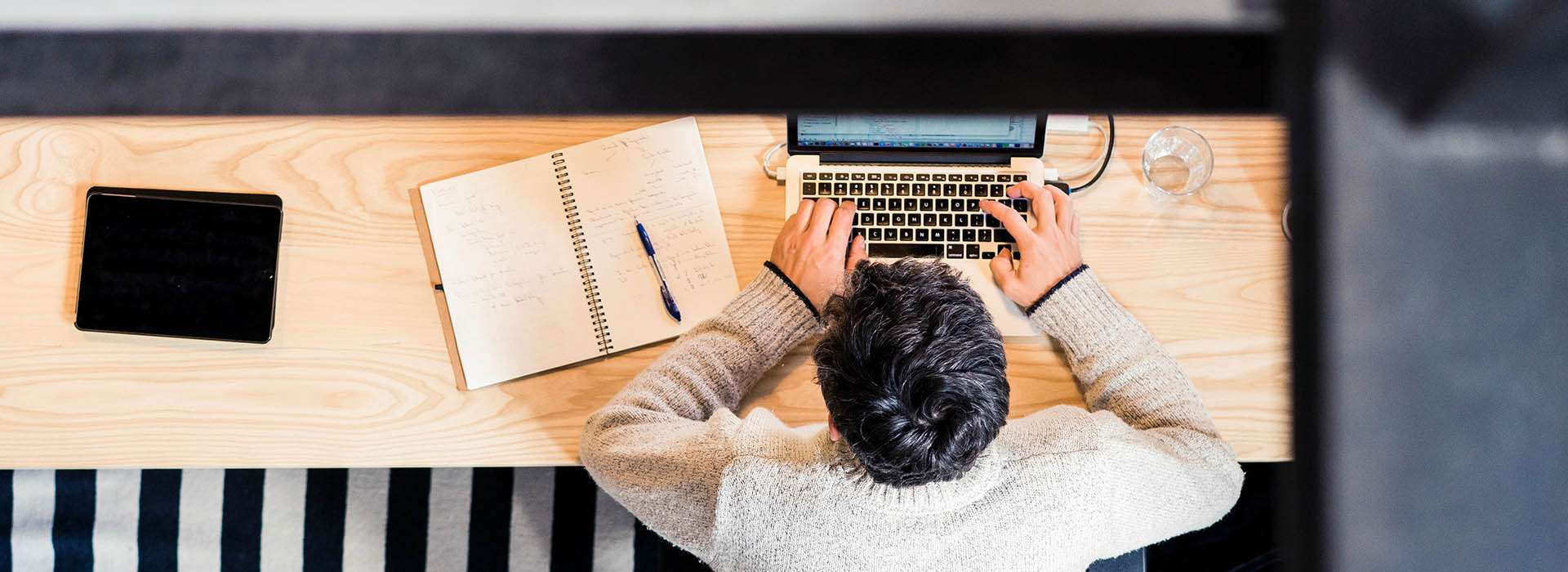 man working on laptop at desk