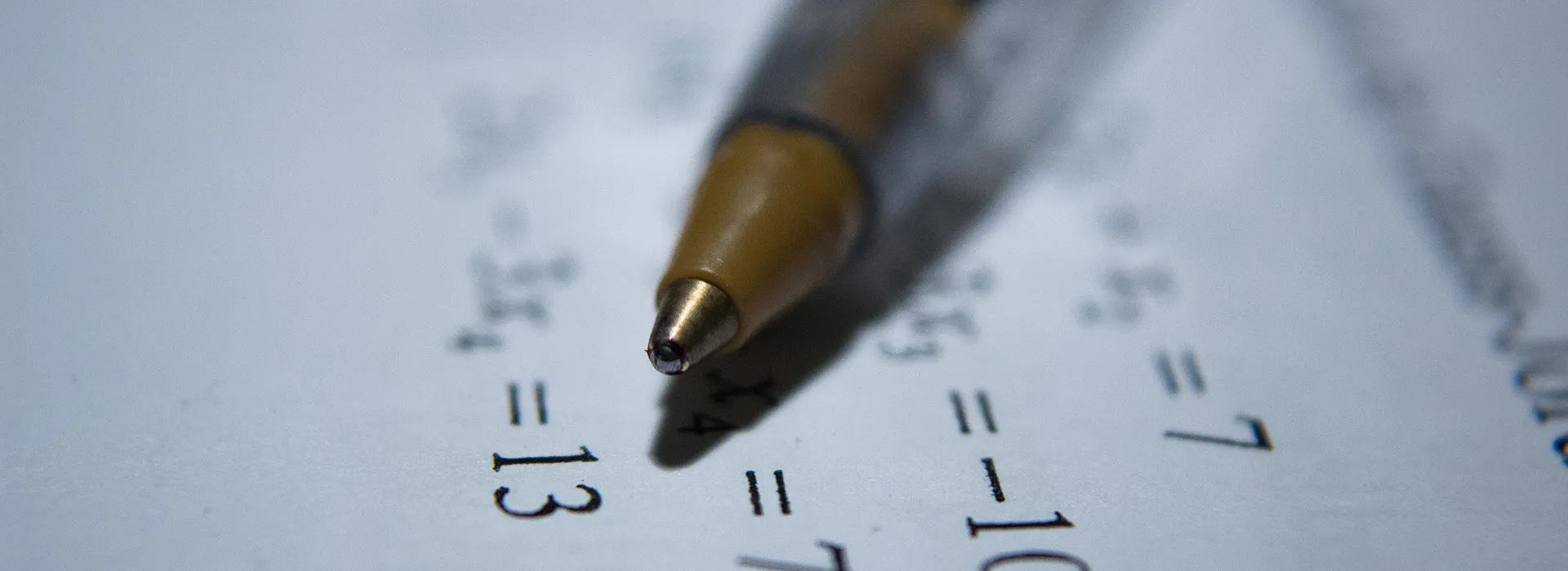 pen sitting on piece of paper