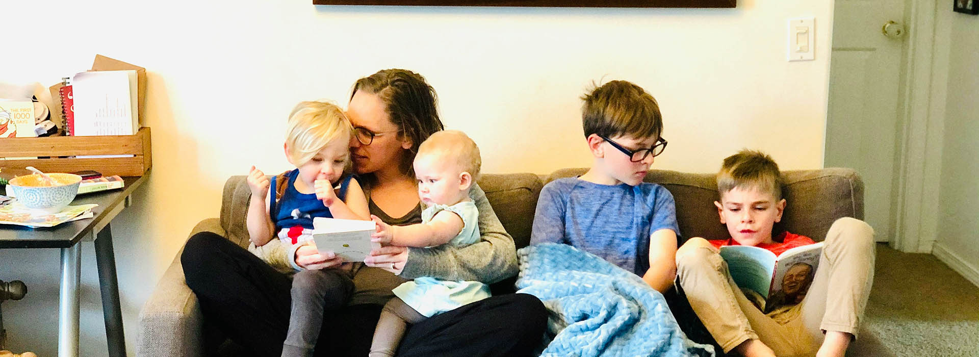 family sat on a sofa