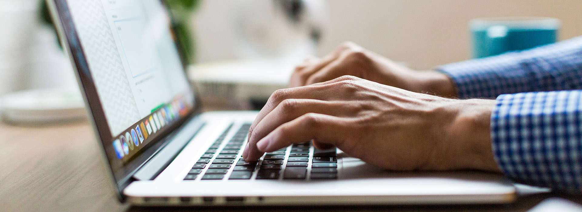 person typing on a laptop
