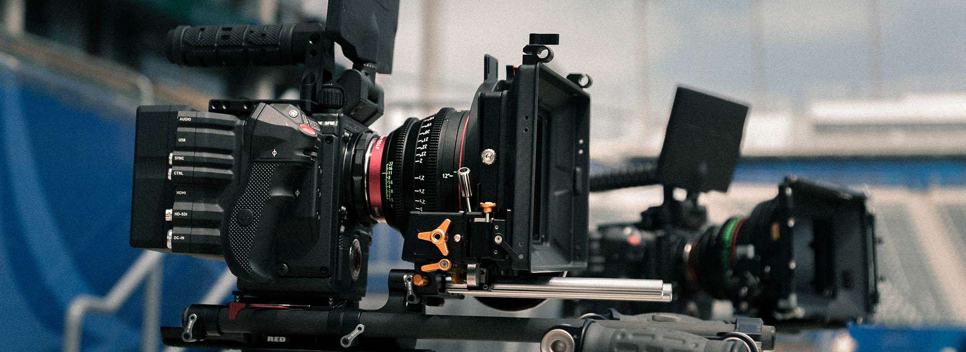 two professional camera rigs set up on tripods