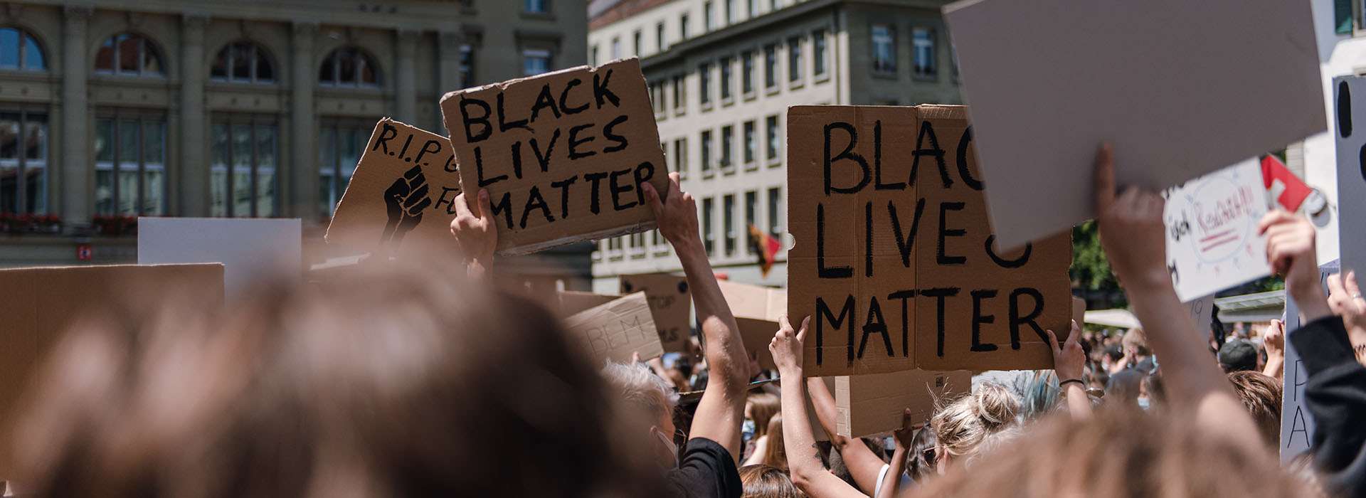 protest with people holding up signs