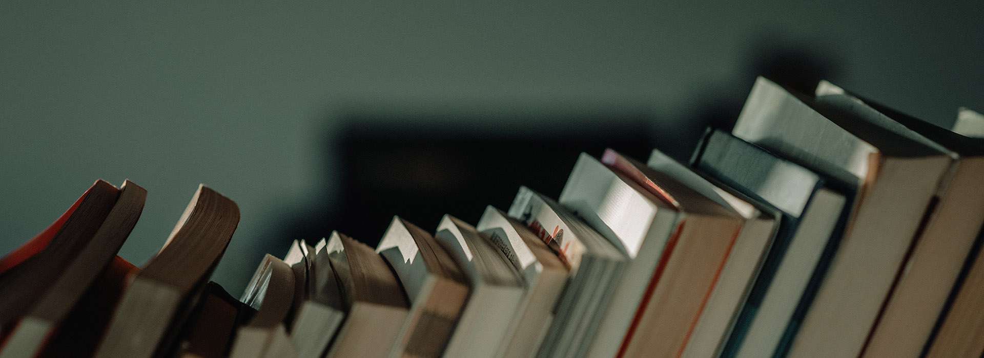 row of leaning books