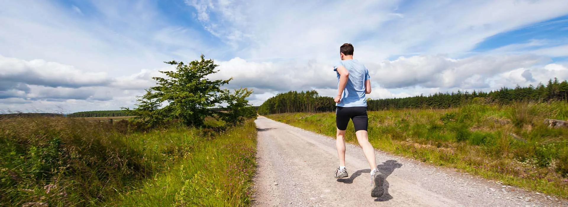 Man running on a country path