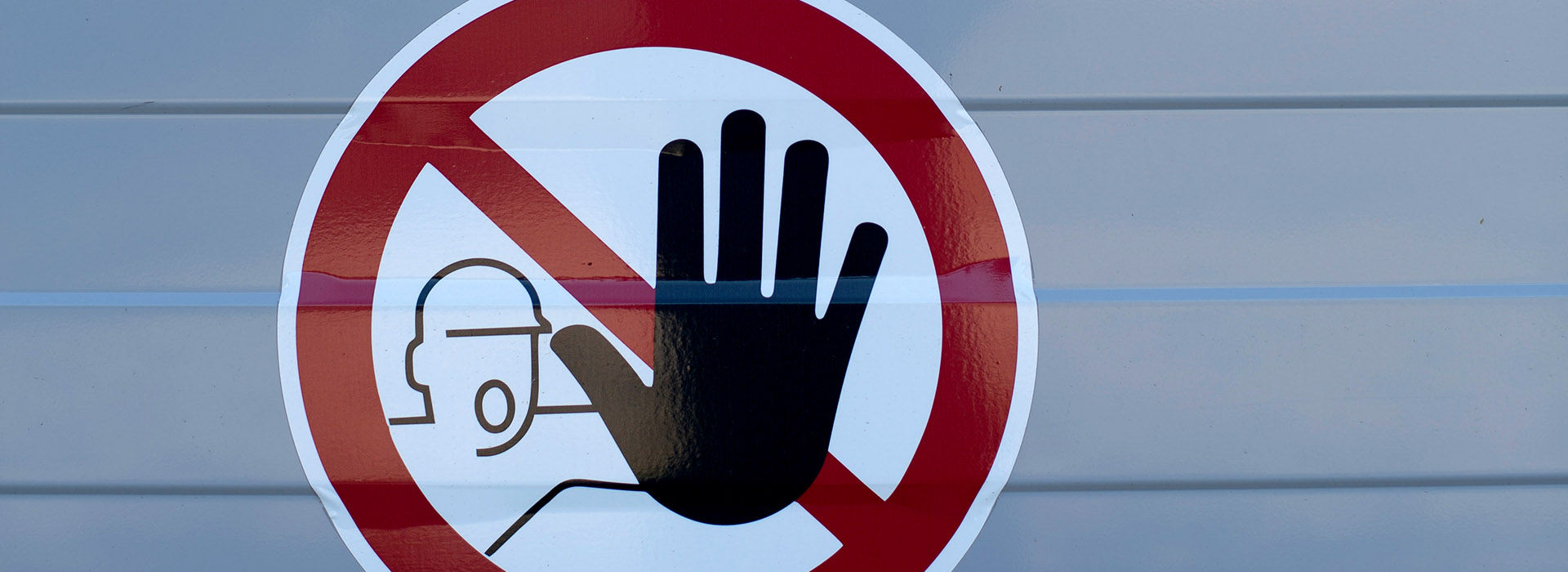 stop sign with hand up