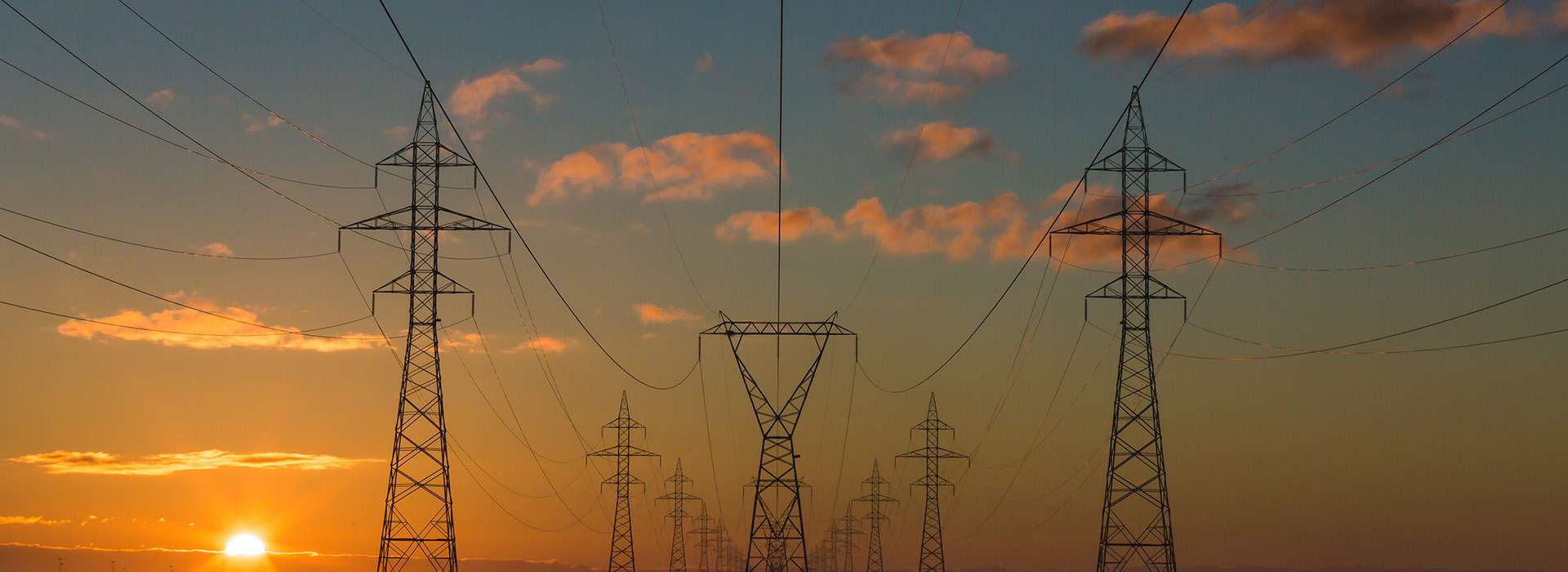electricity pylons at sunset