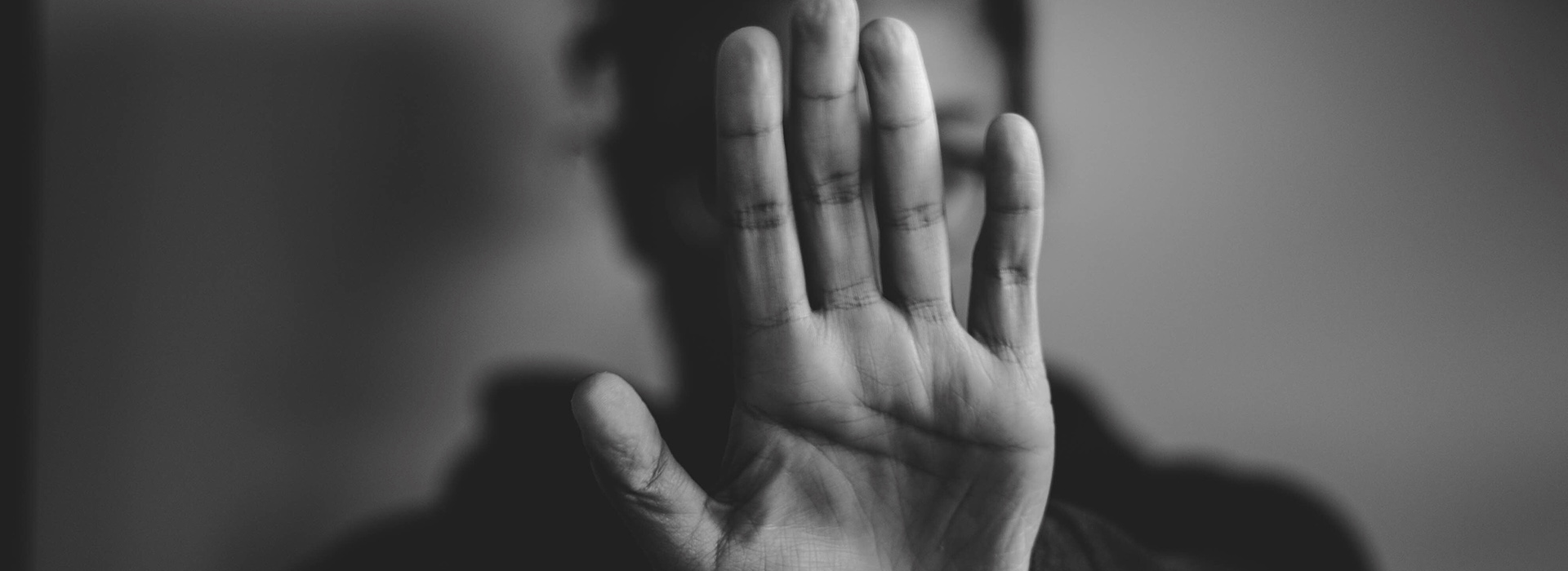 someone holding their hand up in a