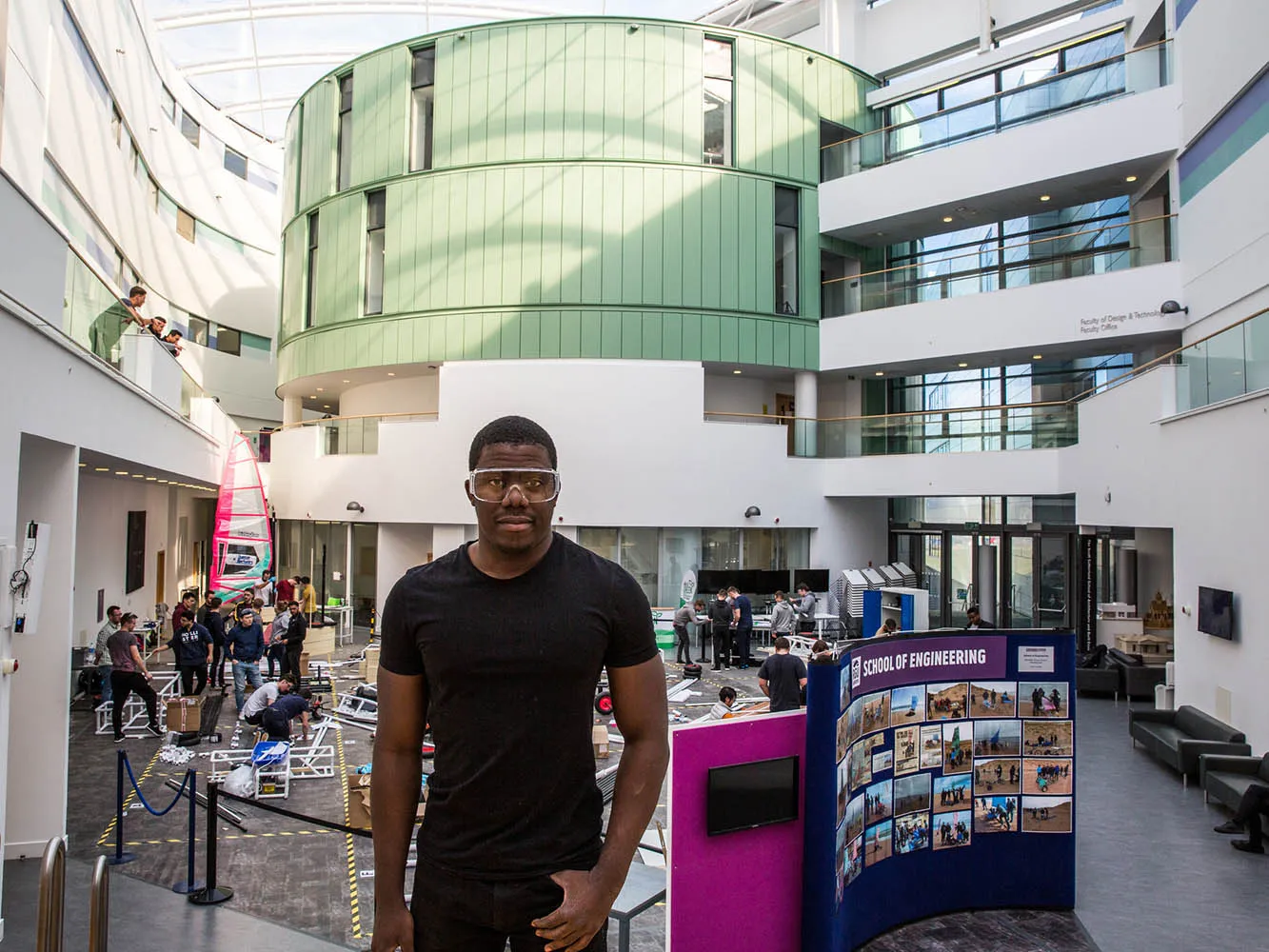 Student with an exhibition behind them