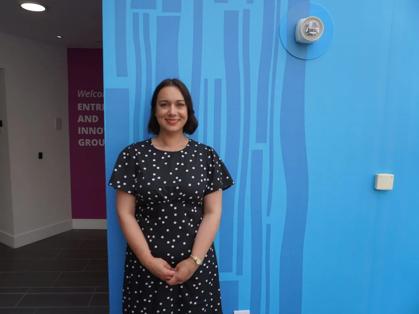Naomi Mcdonald in front of a blue wall at RGU