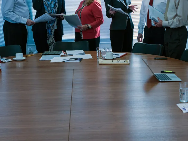 anonymouse people around a table