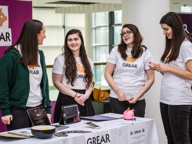 students chatting at an event