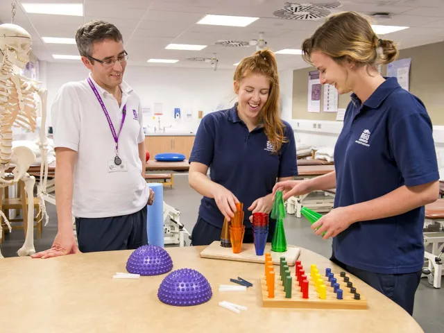 students and lecturer using rehabilitation equipment