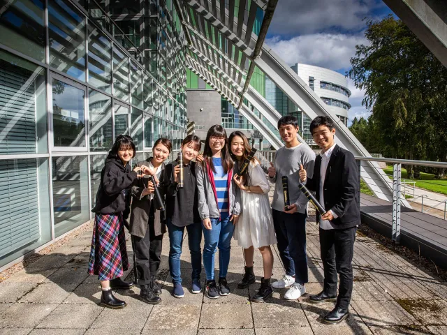 smiling japanese students on rgu campus