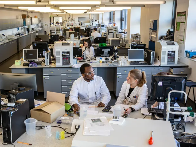 students chatting in life sciences lab