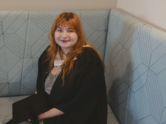 Martha Payne smiling in her graduation robe