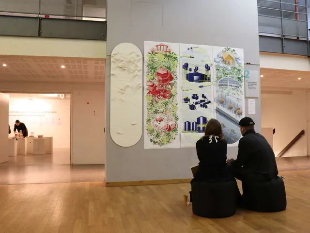 people sitting at an art exhibition