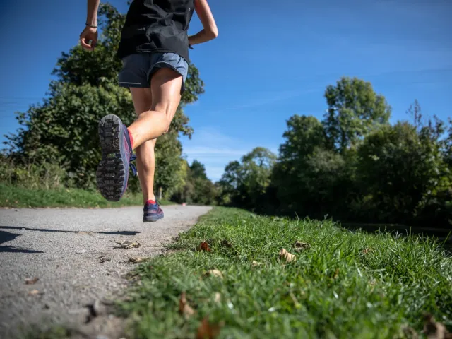 person running through a park