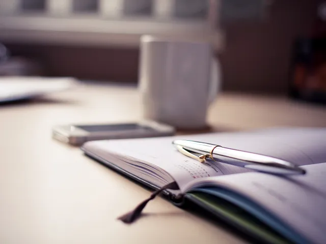 pen sitting on notebook