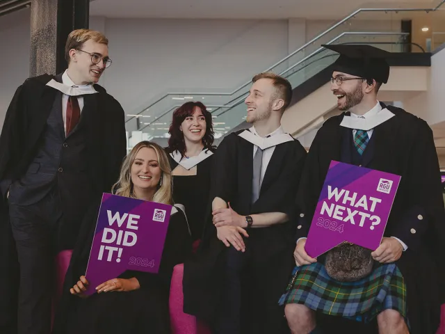 5 graduates celebrating at P&J Live