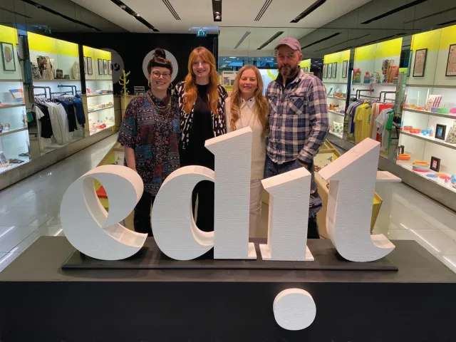 Group of people stand in the EDIT shop space in Bon Accord