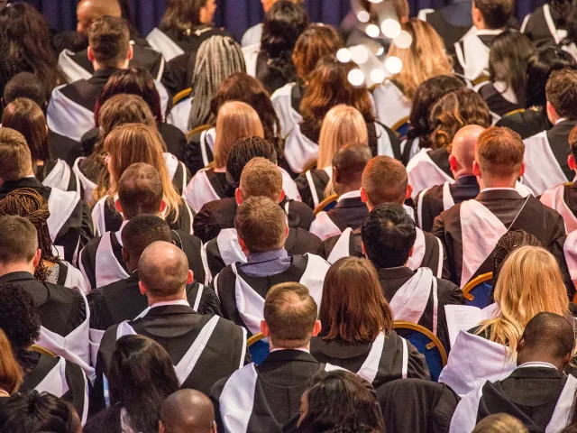 back of students heads at graduation