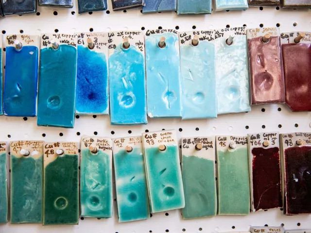 hanging ceramic tiles with different coloured glazes