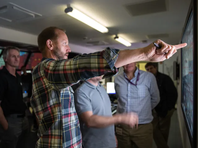 man demonstrating the DART offshore platform Simulator