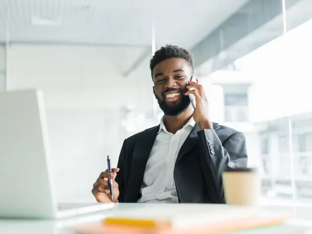 man in a suit on the phone