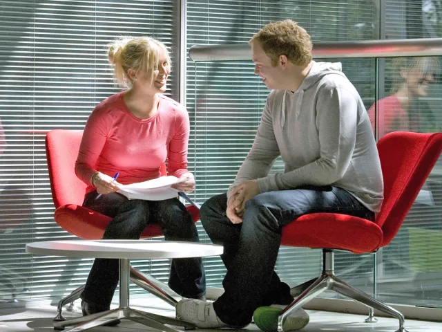 a student and adviser having a conversation