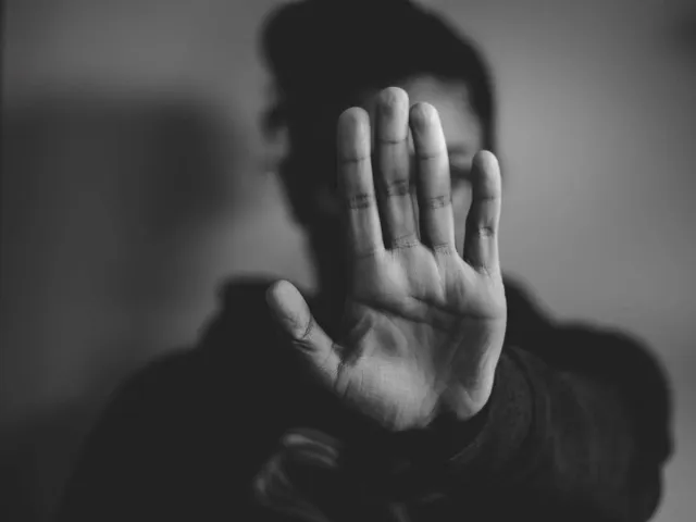 someone holding their hand up in a